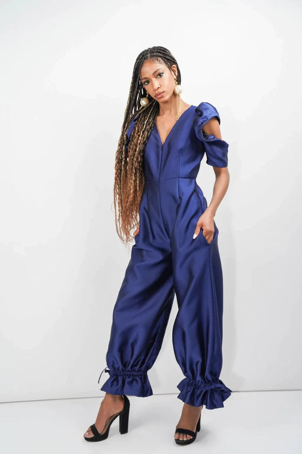woman wearing royal blue jumpsuit