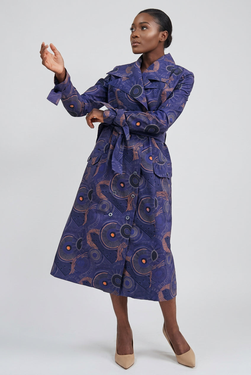 Person wearing a blue patterned coat on a white background