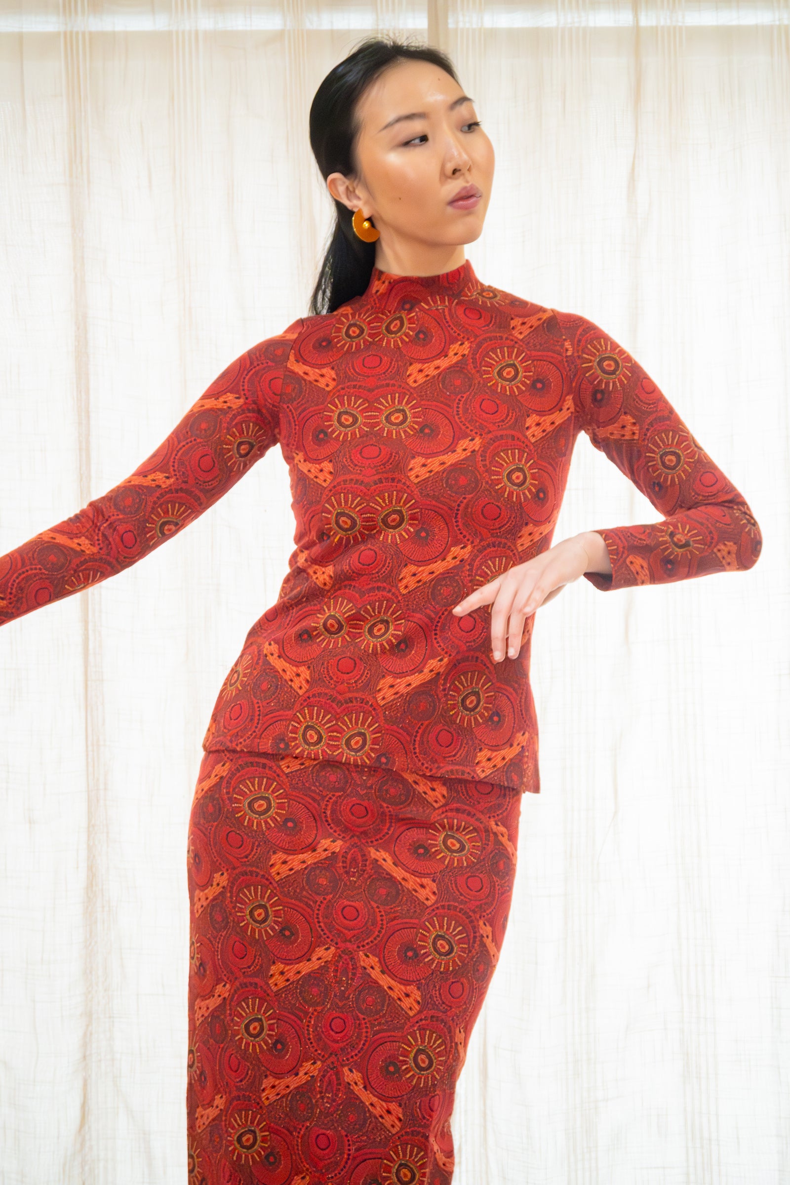Asian woman wearing the Banjul skirt with the matching Algiers top