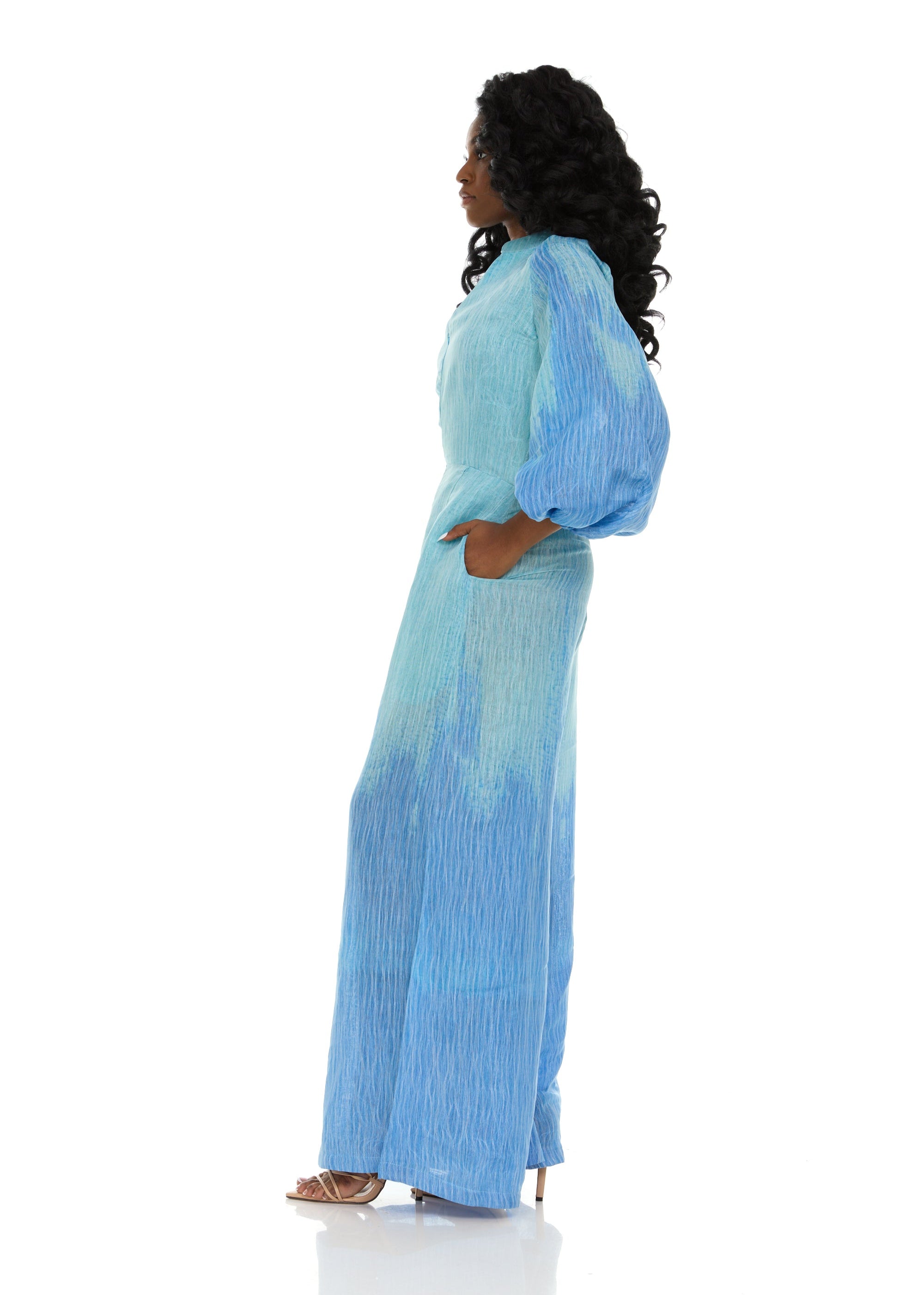 Side view of a woman wearing the Blue Ombre jumpsuit