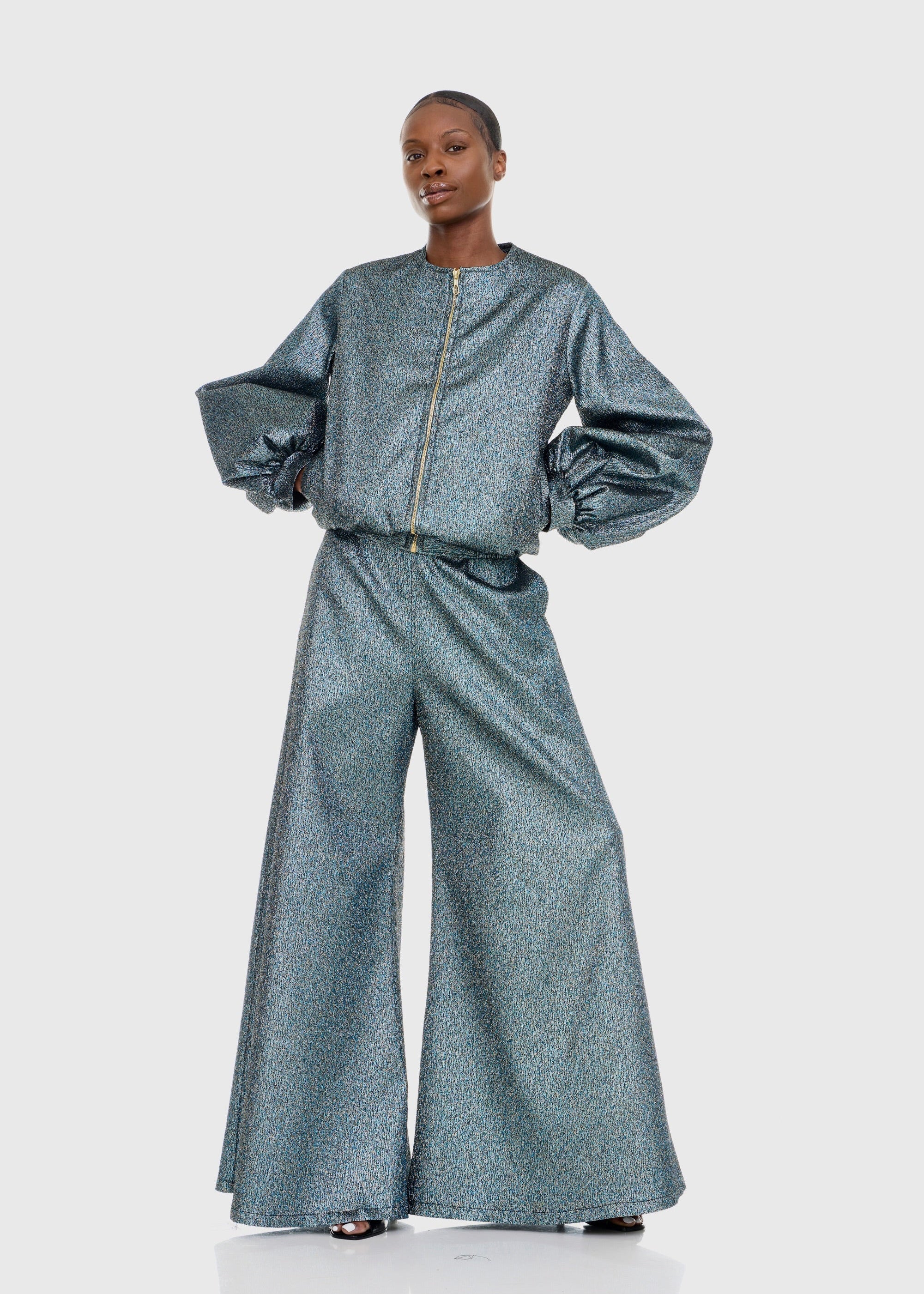 Black woman wearing Strapless Green Shimmer Flared Pants