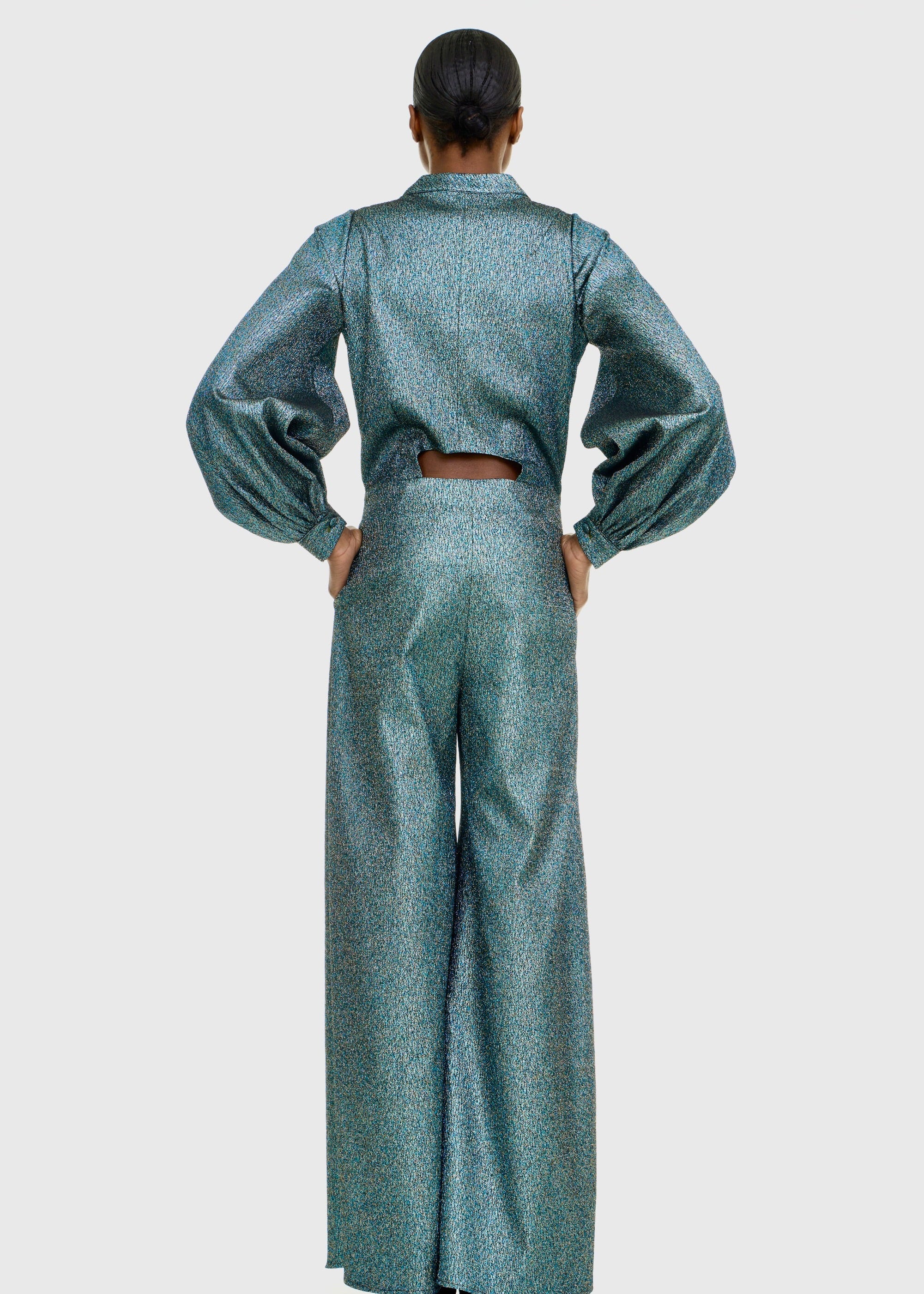 Black woman wearing Green Shimmer Jumpsuit