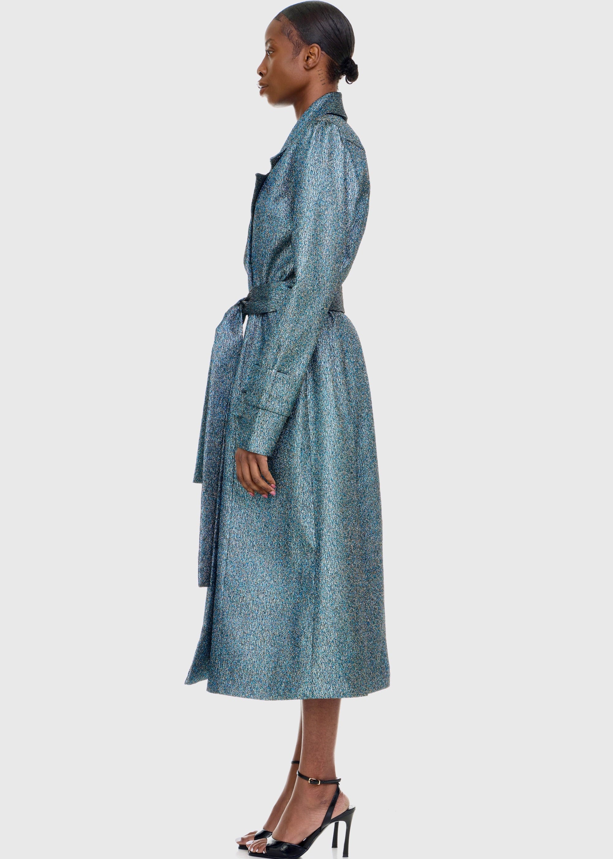 Black woman wearing Green Shimmer Trenchcoat