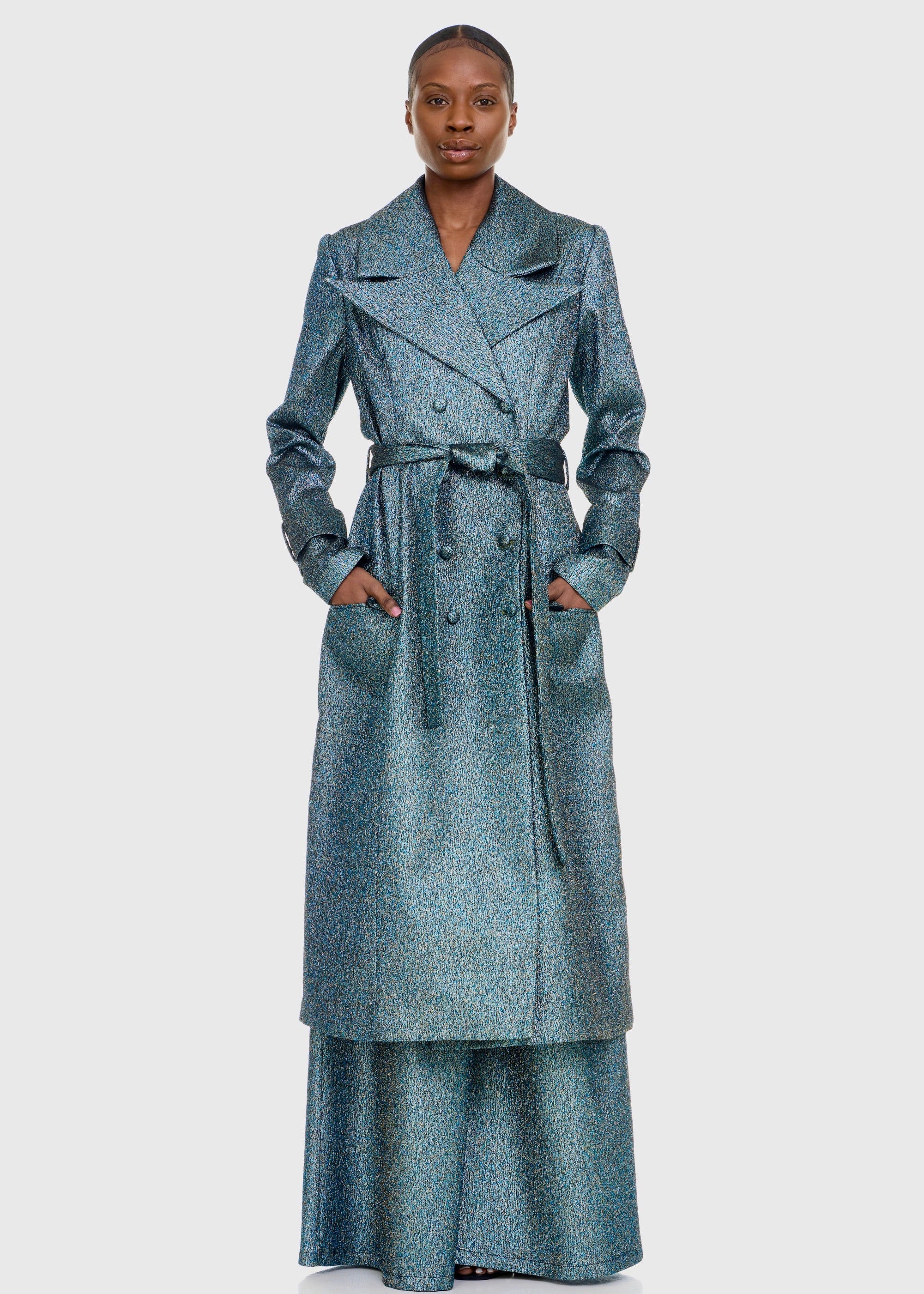 Black woman wearing Green Shimmer Trenchcoat with matching Flare pants