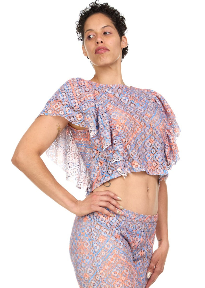 Woman wearing a patterned outfit on a white background