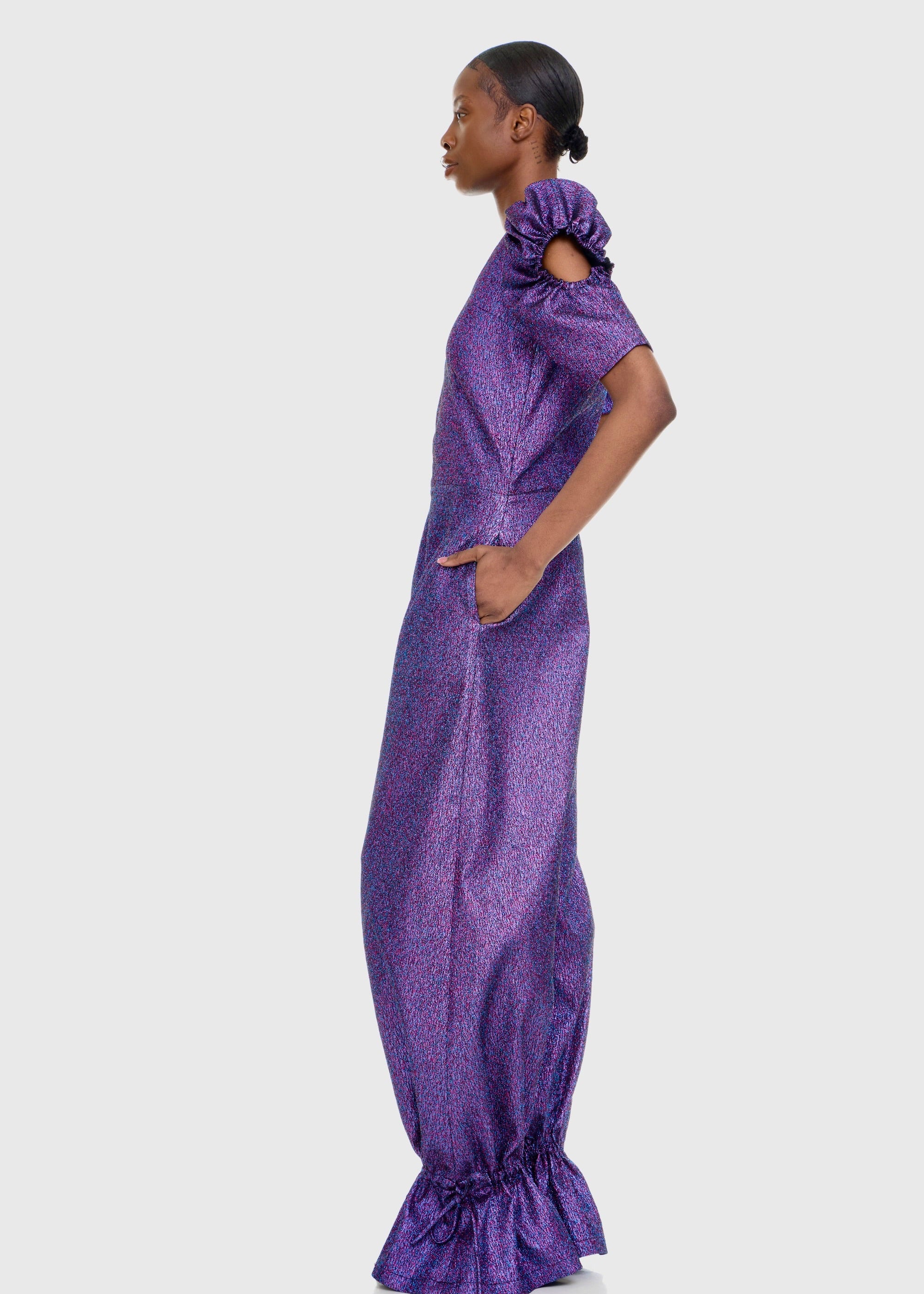 Black woman wearing Purple Shimmer Jumpsuit