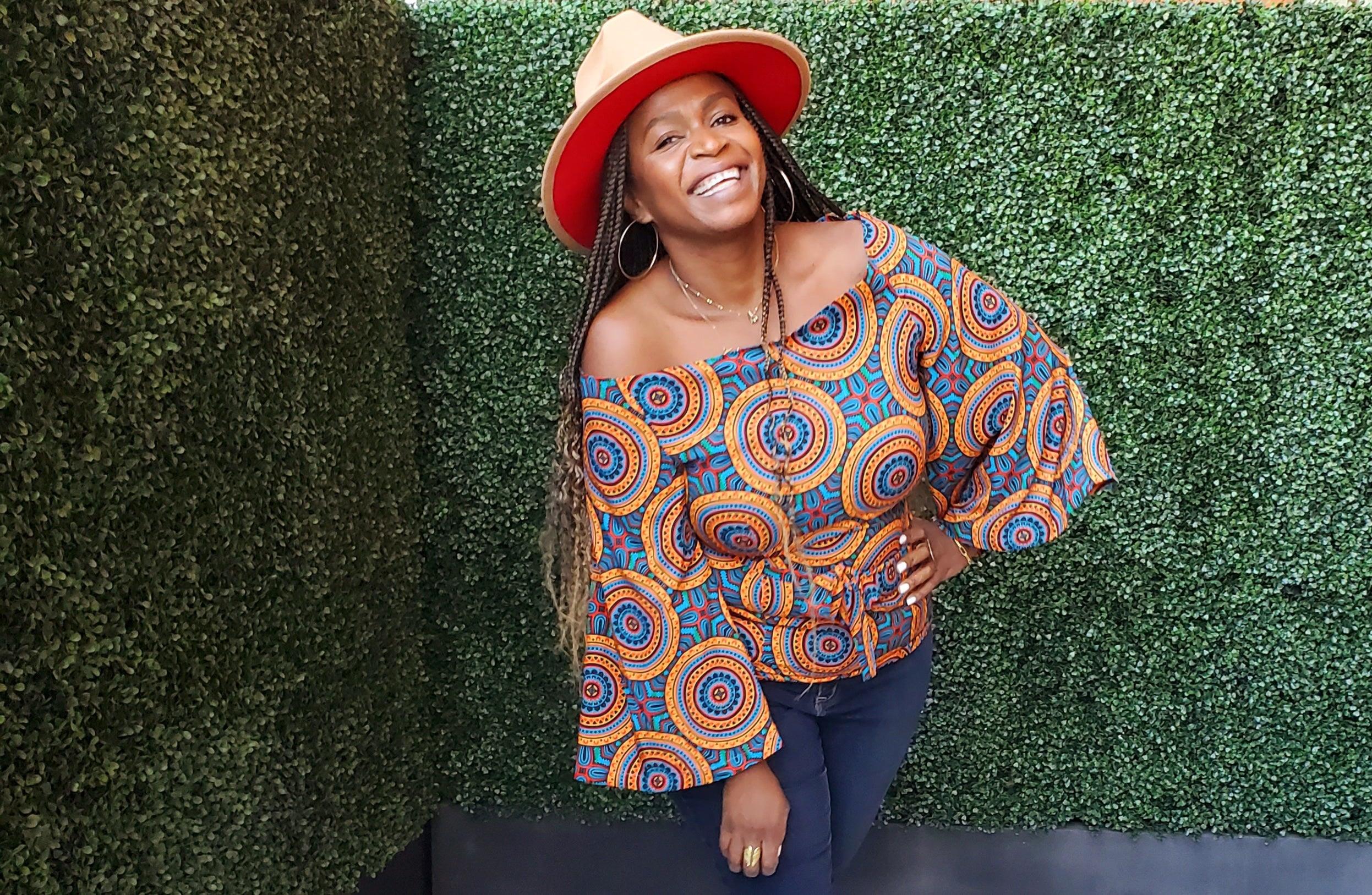 Full-length view of the Aqua Blouse worn with a hat