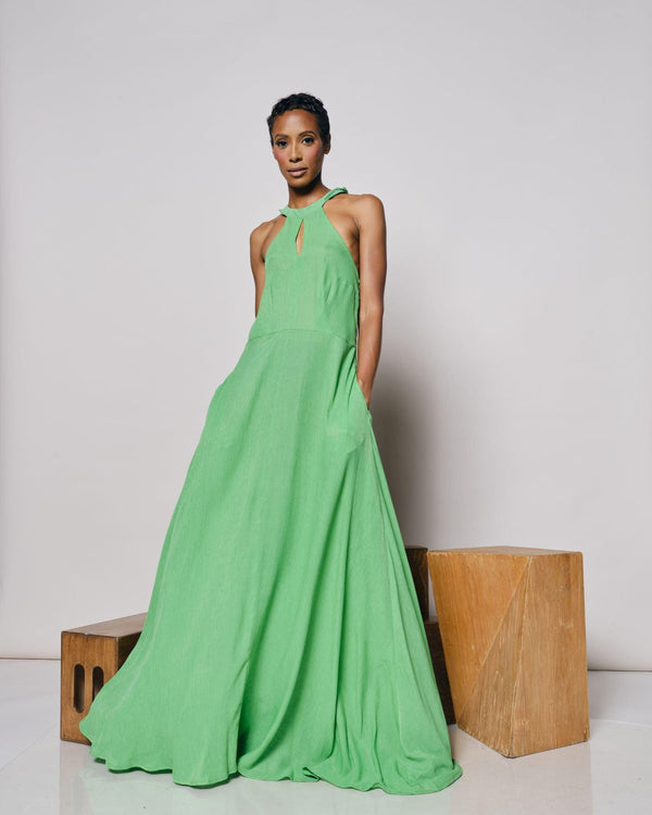A model showcasing the Cape Verde Maxi Dress in a lush green color