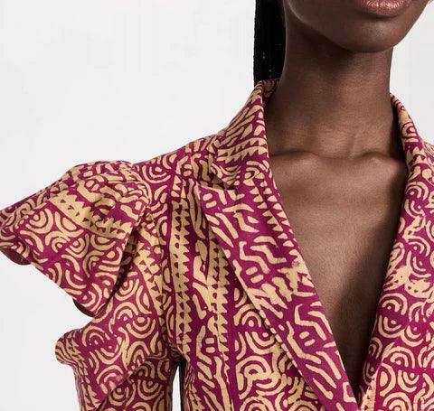 closeup of woman wearing african inspired top