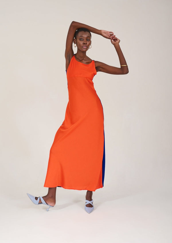 Model posing with arms up in the KAHINDO Capepoint Slip Dress