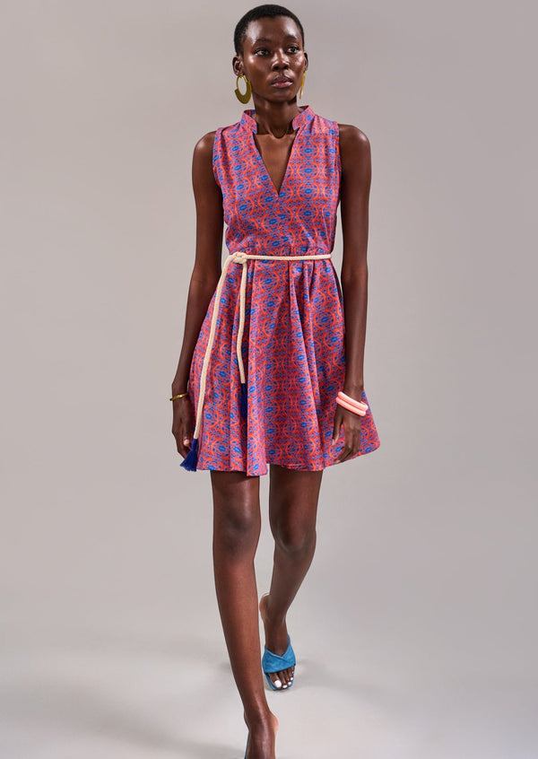 Model walking forward wearing the KAHINDO Houtbay Sleeveless Dress, styled with blue heels