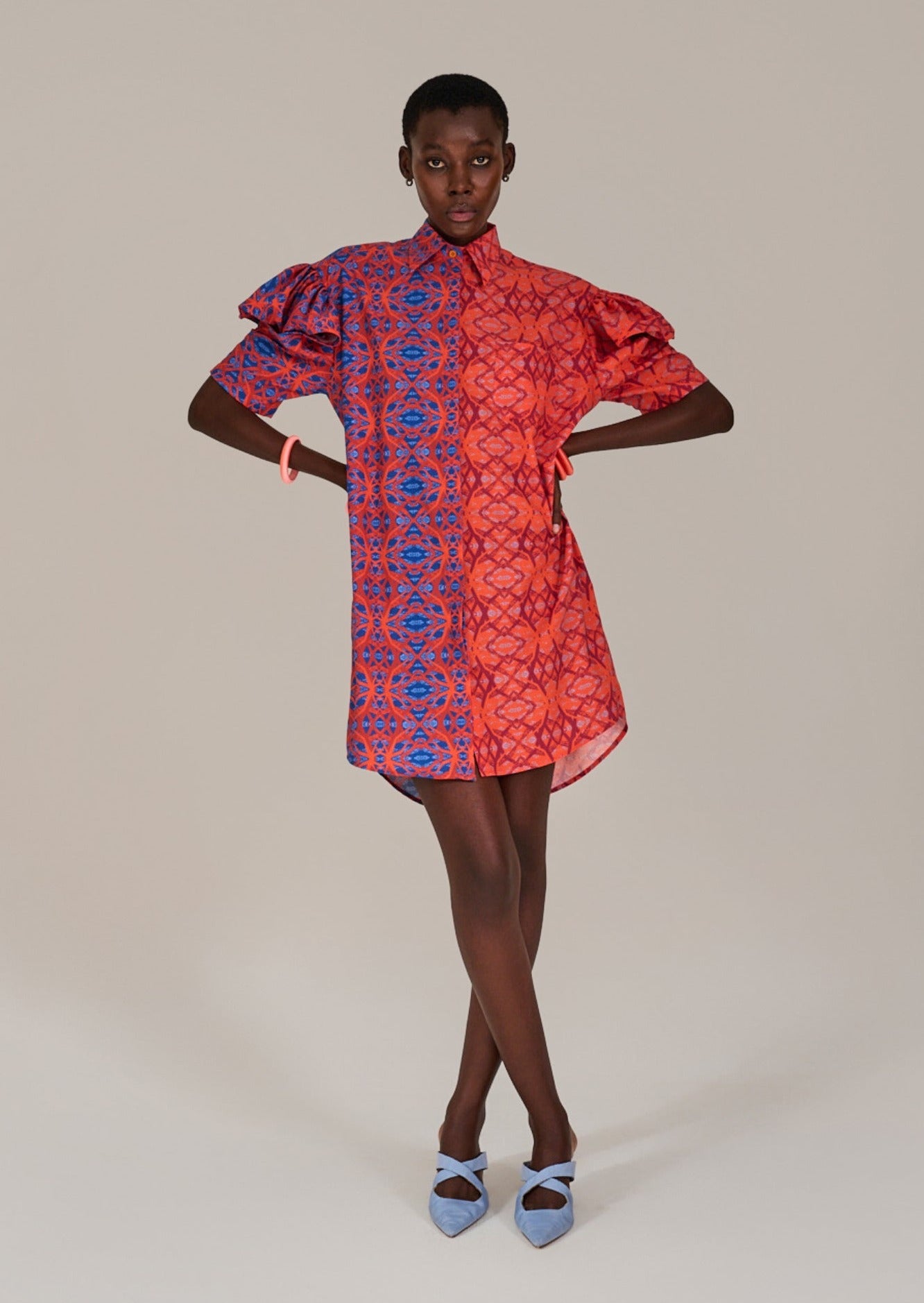 Model standing with hands on hips and crossed legs in the KAHINDO Chinchilla Shirtdress
