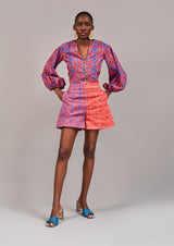 Model with hands in pocket of the KAHINDO Constantia Shorts, styled with the Two Oceans Blouse