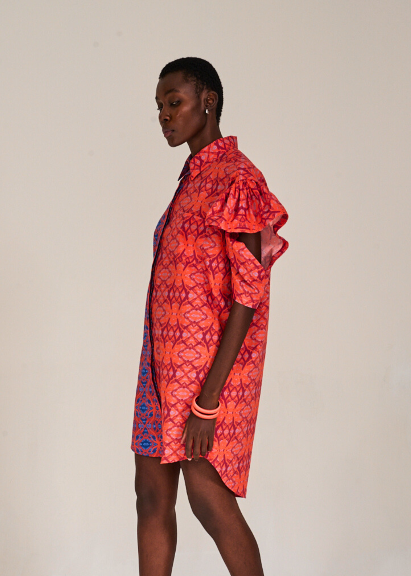 Model standing sideways in the KAHINDO Chinchilla Shirtdress