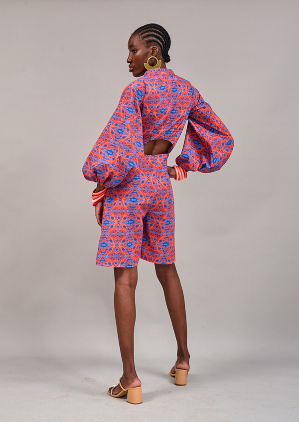 Model facing backwards to show the cut-out back detail of the KAHINDO Claremont Romper
