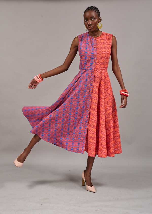 Model swaying onto one leg to show the movement of the KAHINDO Clifton Sleeveless Shirtdress