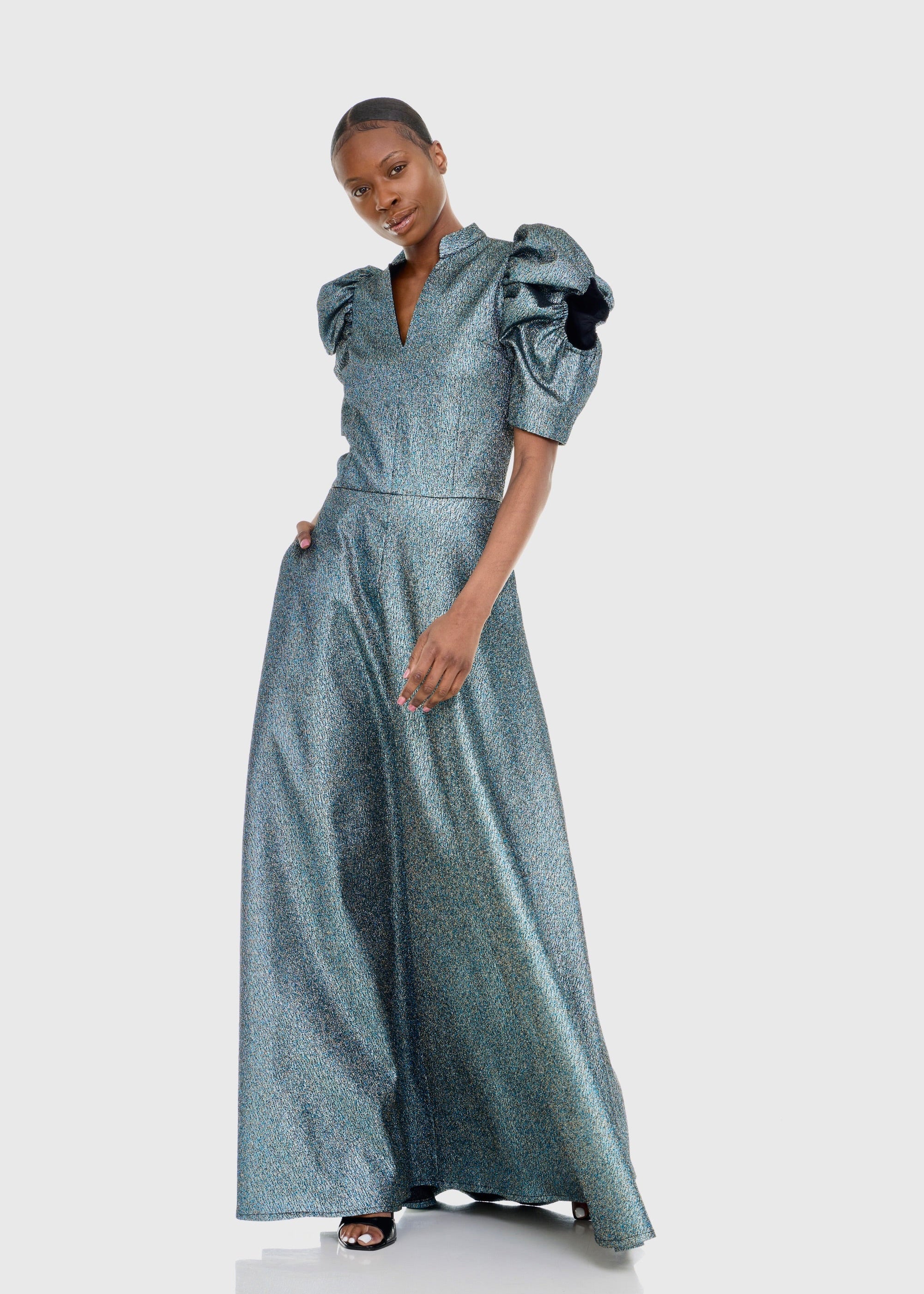 Black woman wearing Green Cleopatra Dress
