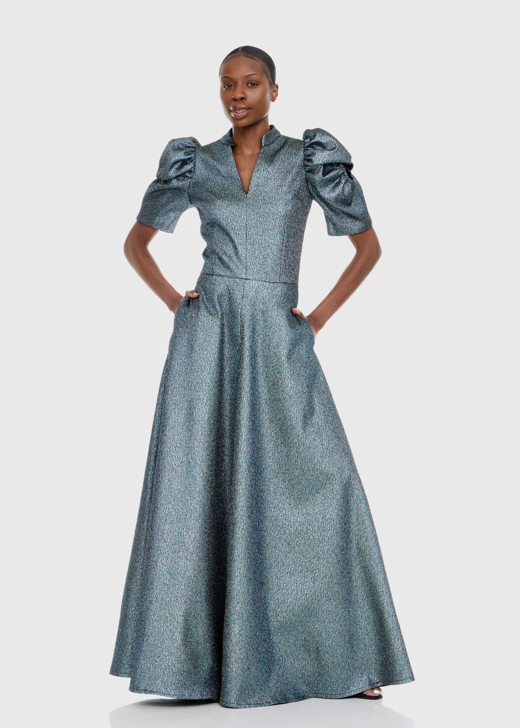 Black woman wearing Green Cleopatra Dress