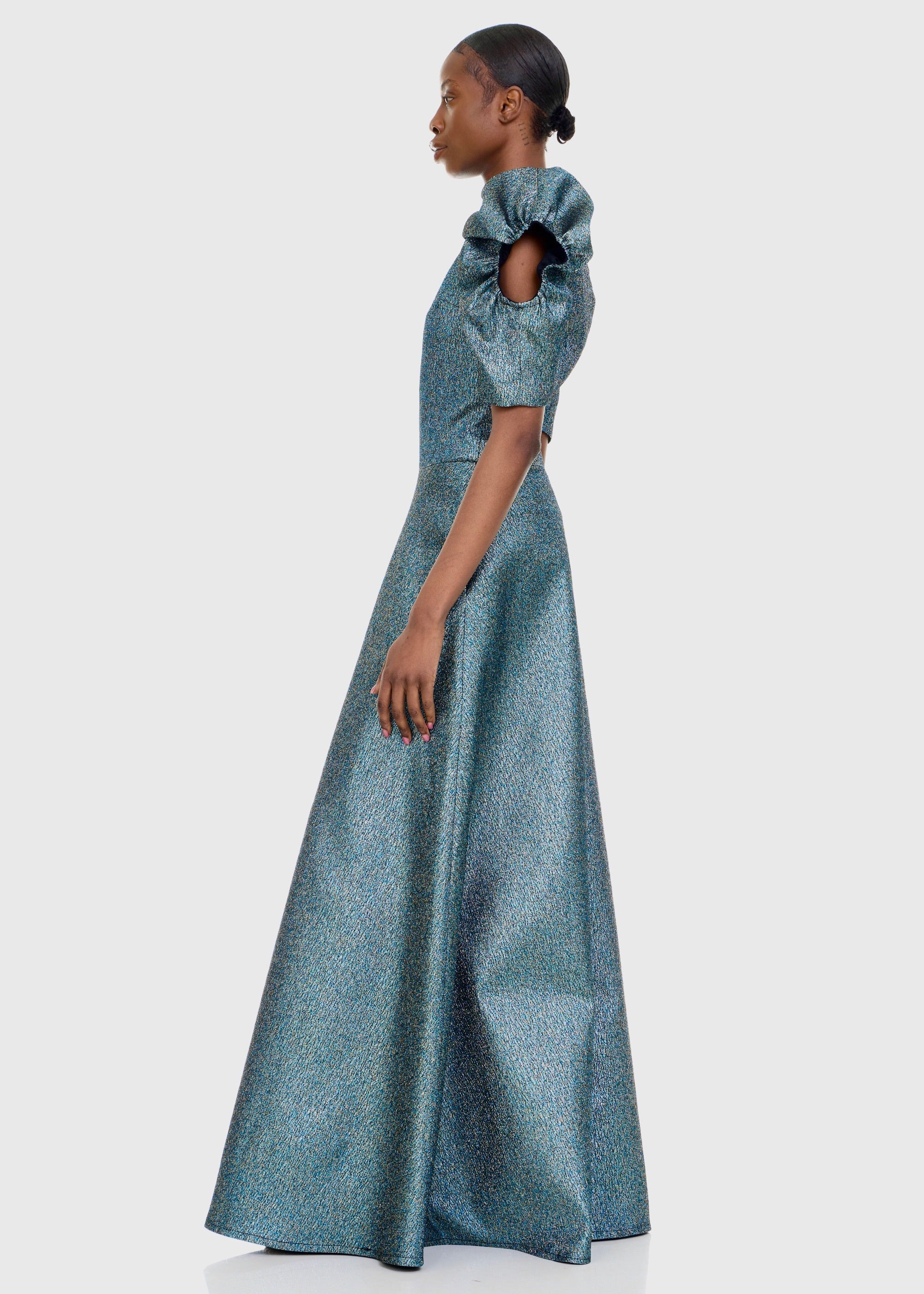Black woman wearing Green Cleopatra Dress
