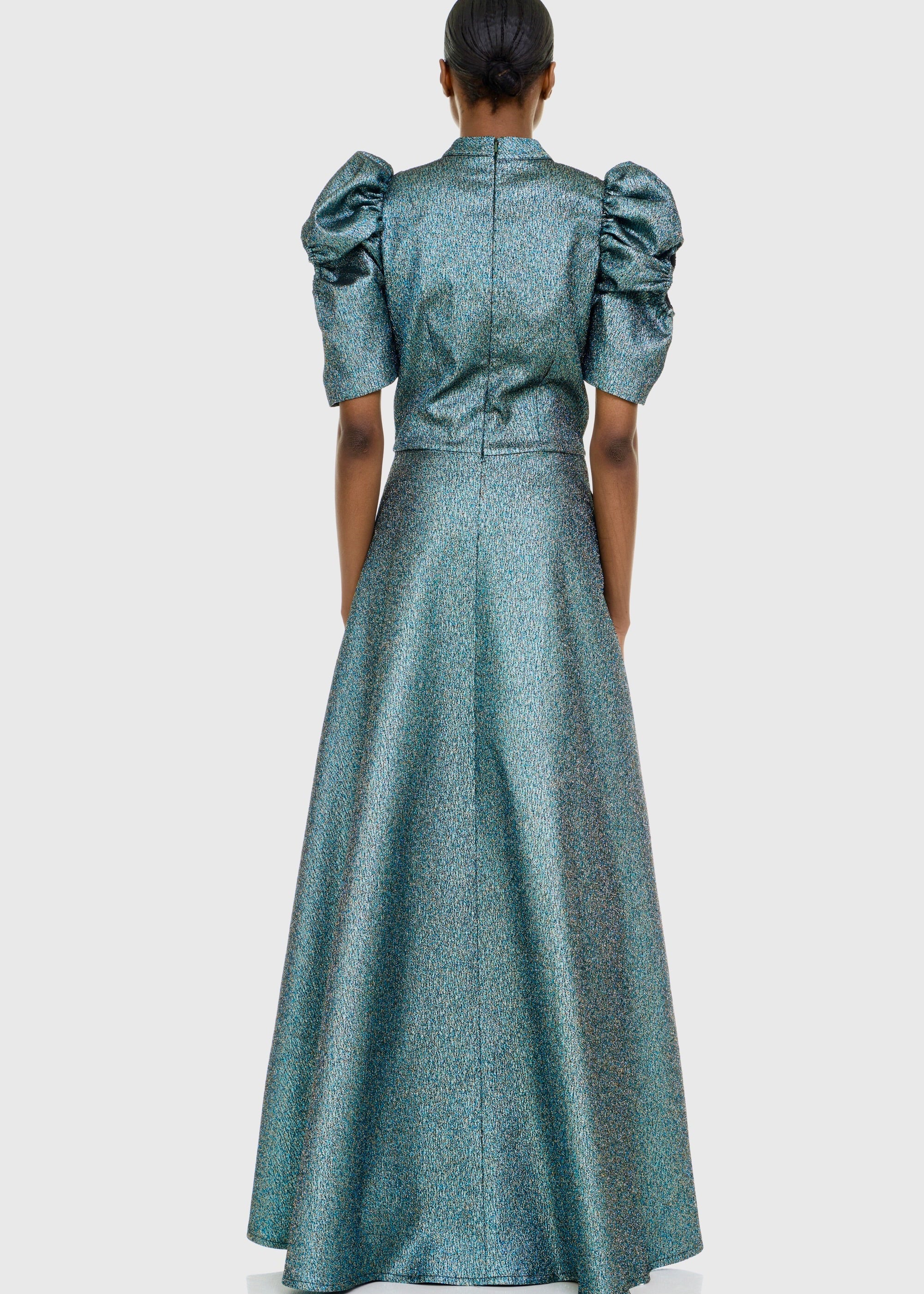 Black woman wearing Green Cleopatra Dress