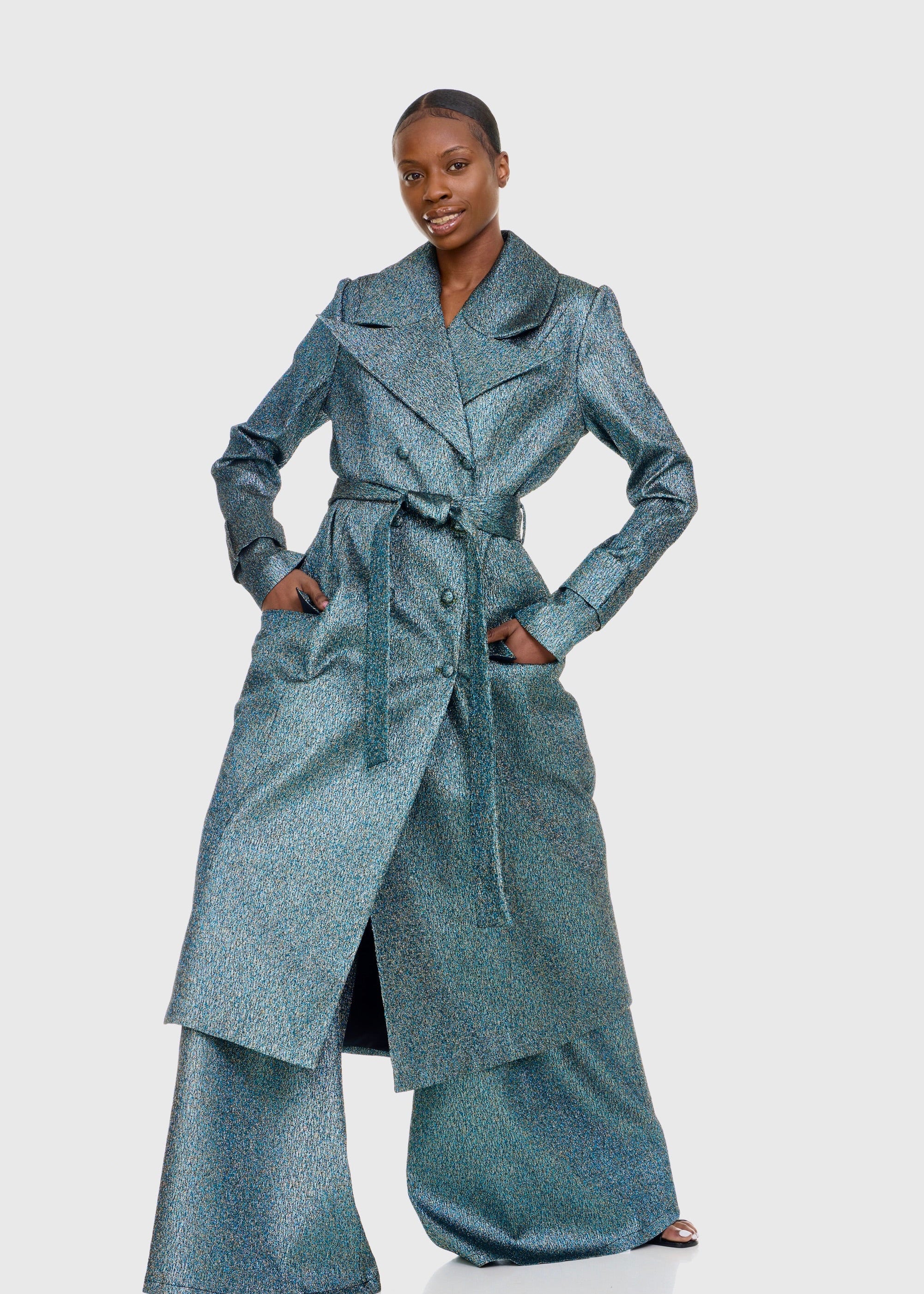 Black woman wearing Green Shimmer Trenchcoat with matching Flare pants
