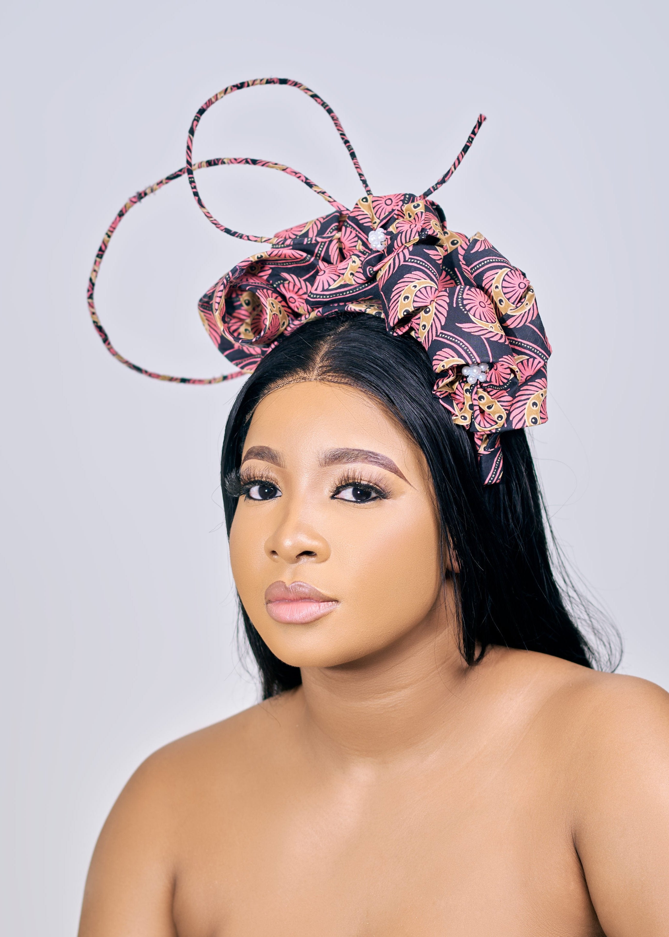 Model wearing Pink and Black fascinator