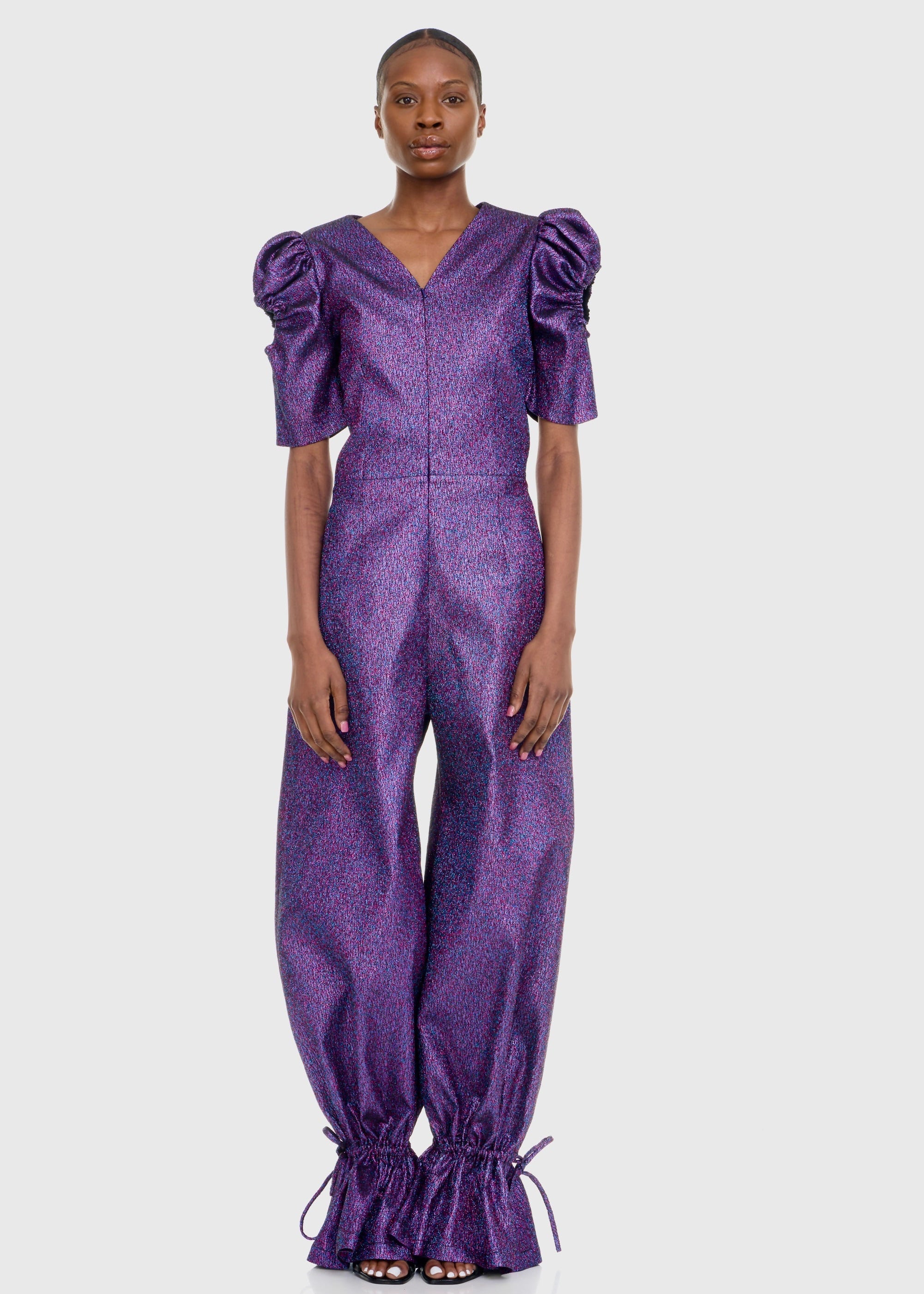 Black woman wearing PurPle Shimmer Jumpsuit