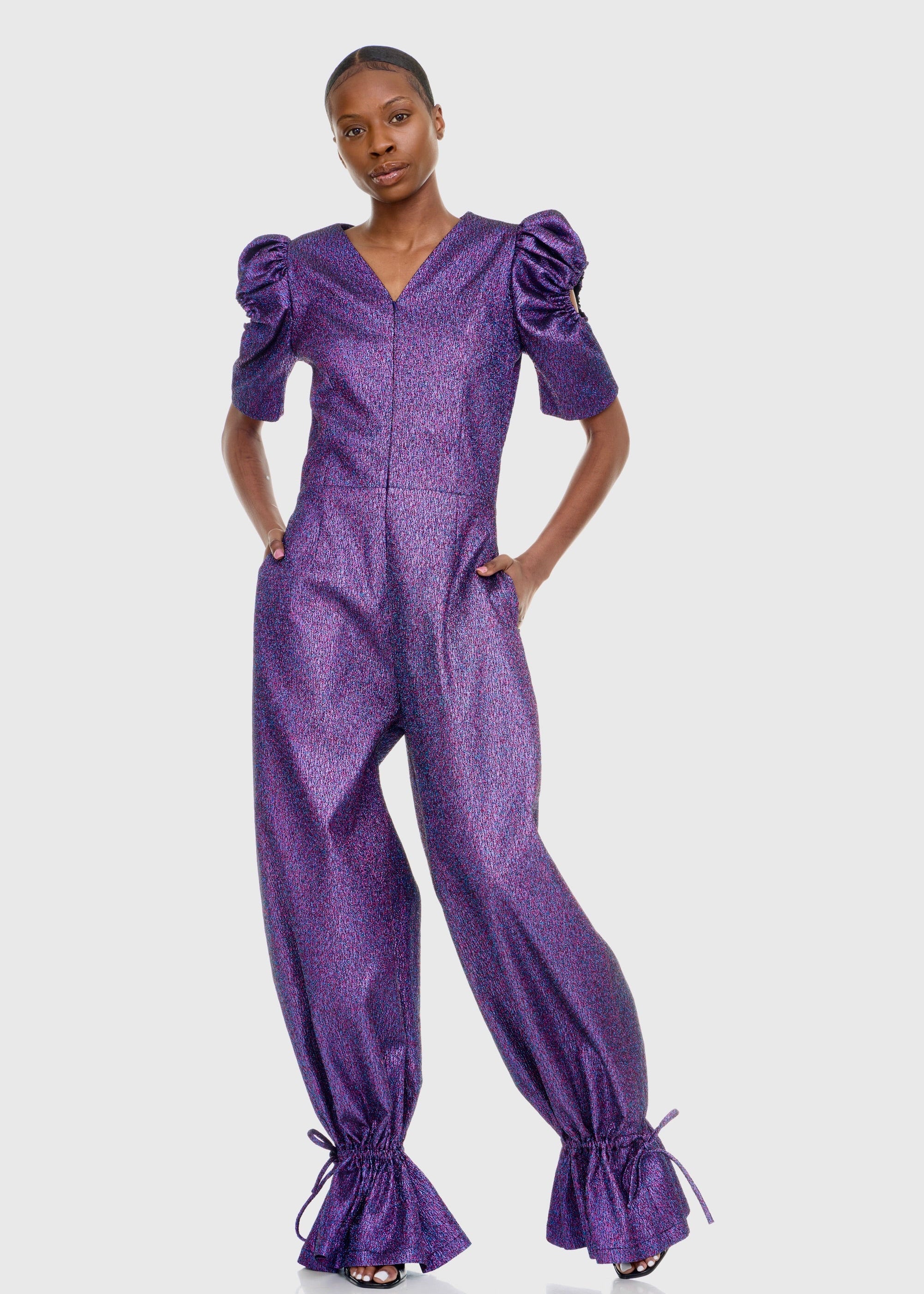 Black woman wearing Purple Shimmer Jumpsuit