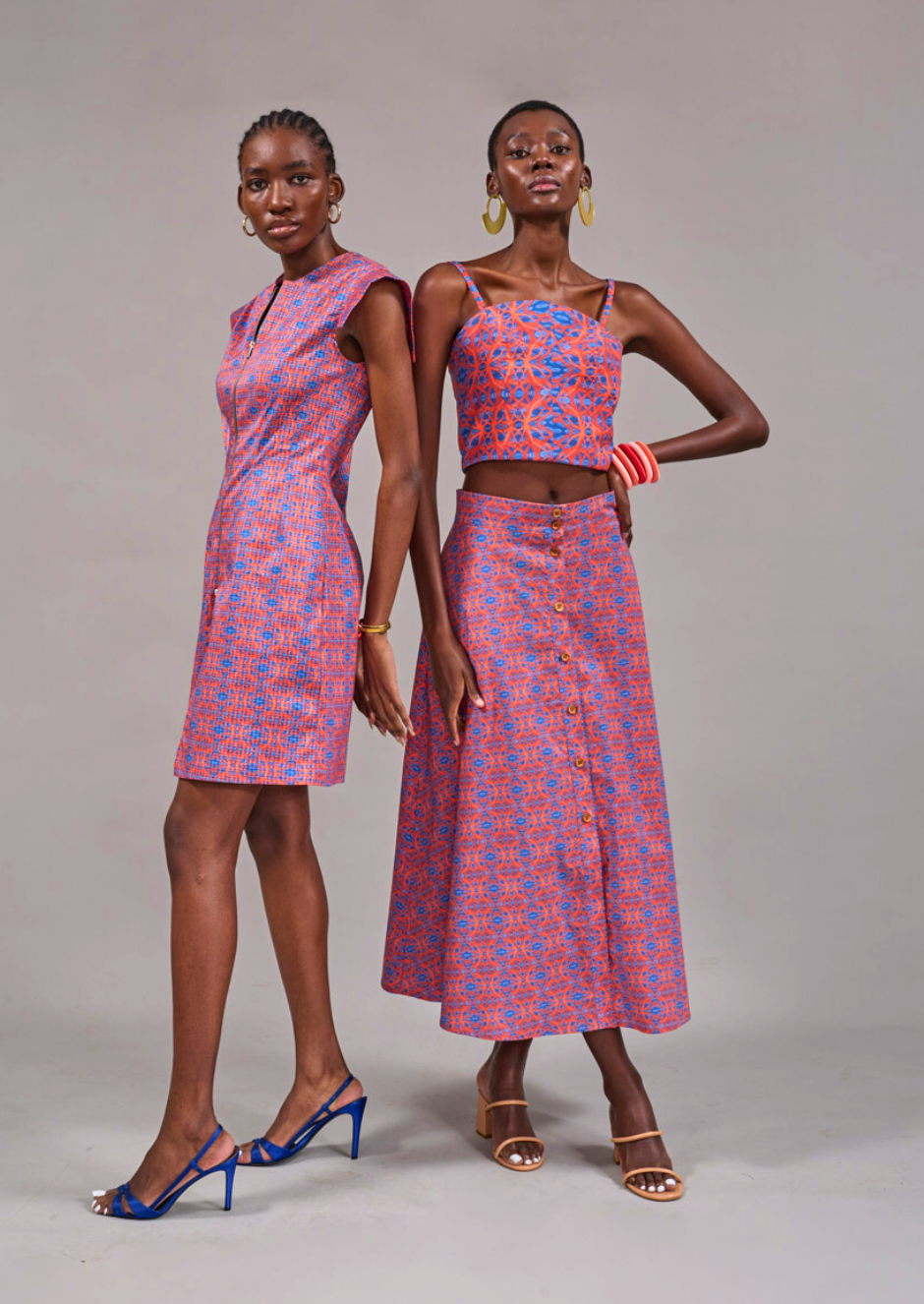 Two models posing together in the Rand Tunic Dress and the Tang Top styled with the matching Camps Bay Print Skirt by KAHINDO