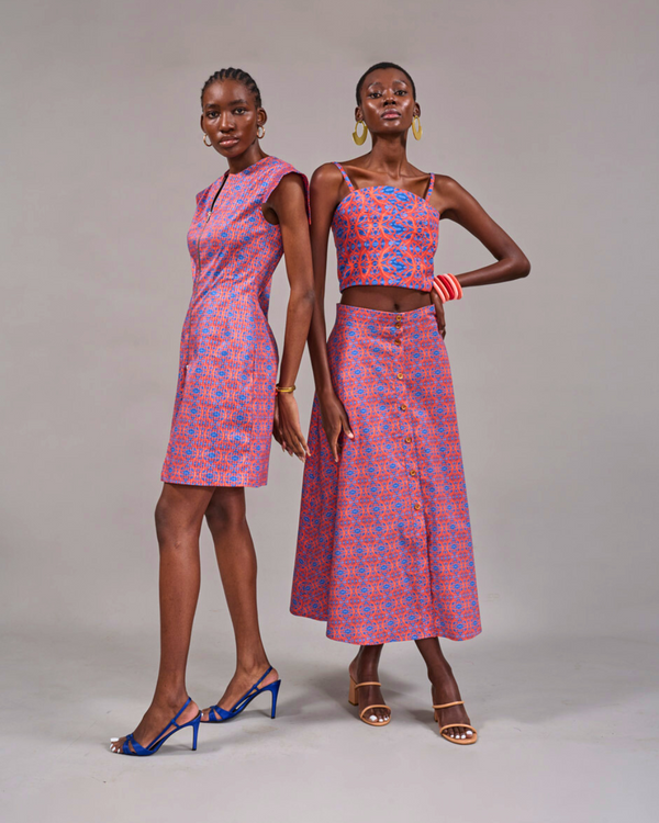 Two models posing together in the Rand Tunic Dress and the Tang Top styled with the matching Camps Bay Print Skirt by KAHINDO