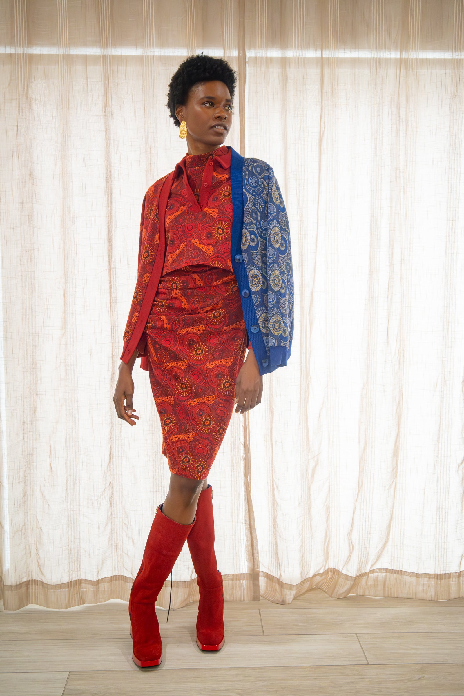 Black woman wearing the Red & Blue Colorblock Jacquard Cardigan