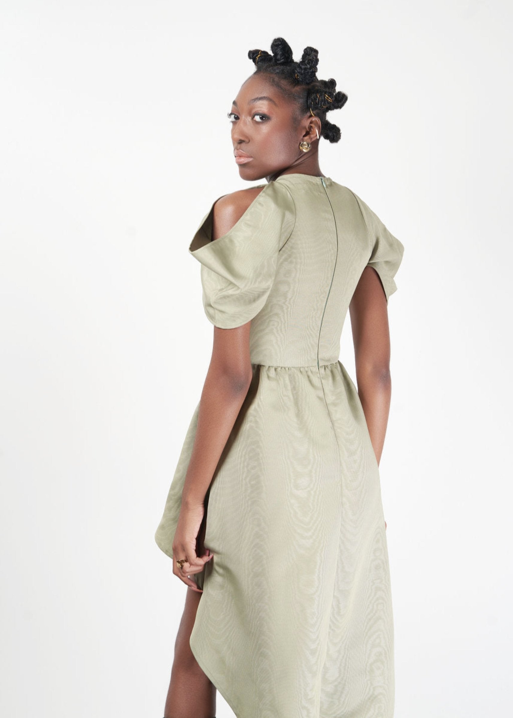 Back view of model wearing High low dress in green