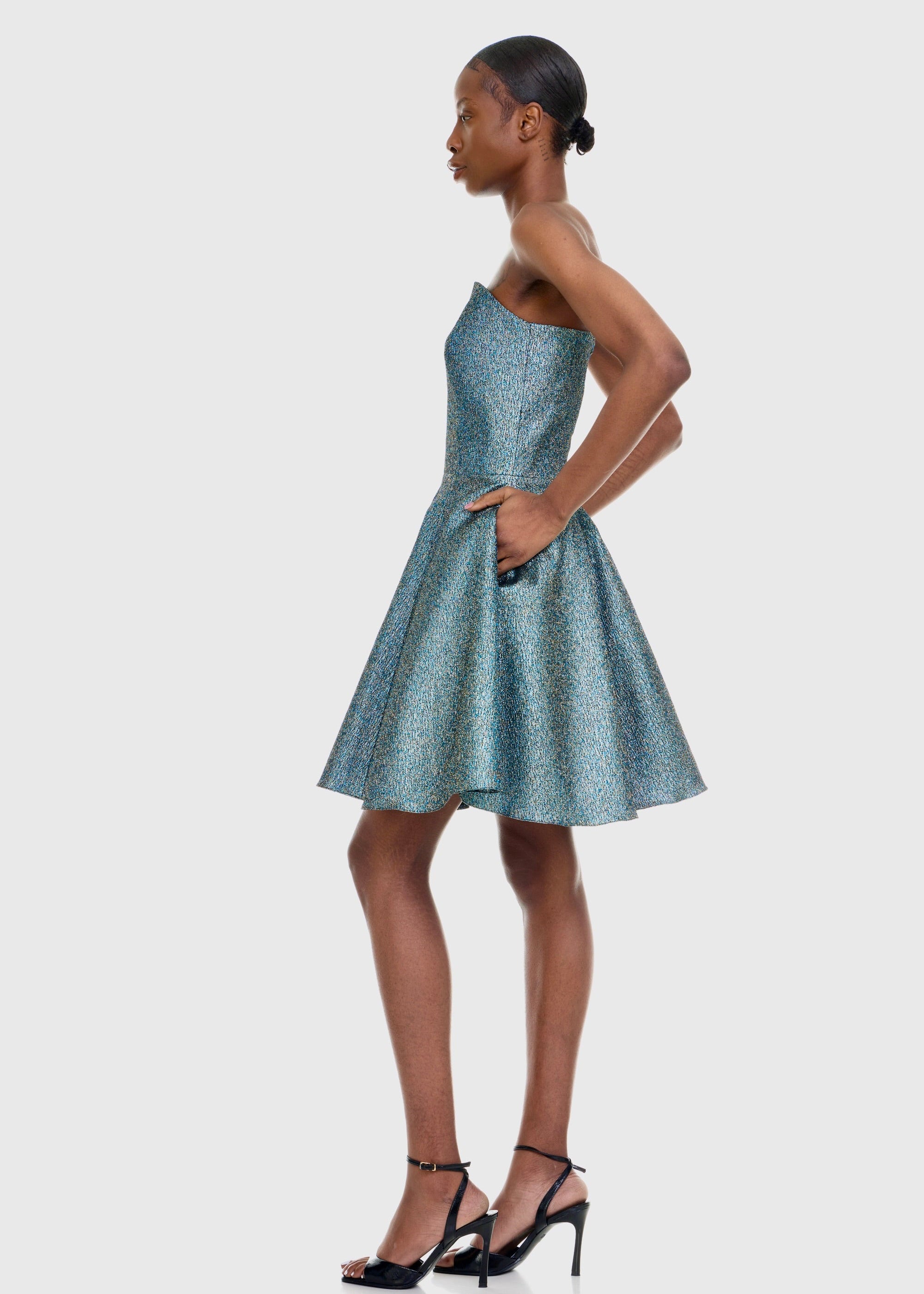 Black woman wearing Strapless Green Shimmer Mini dress