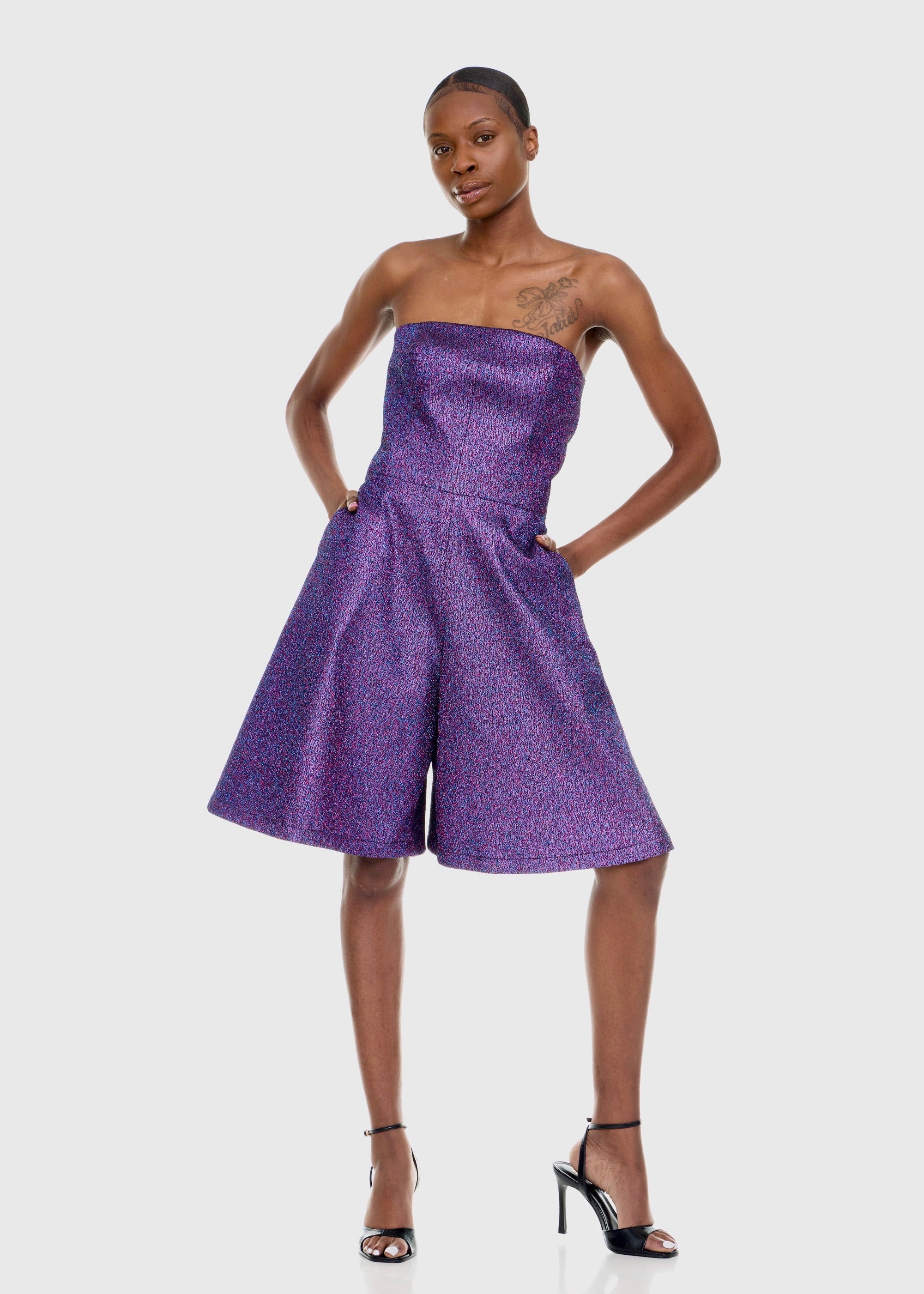 Black woman wearing Strapless Purple Shimmer Romper