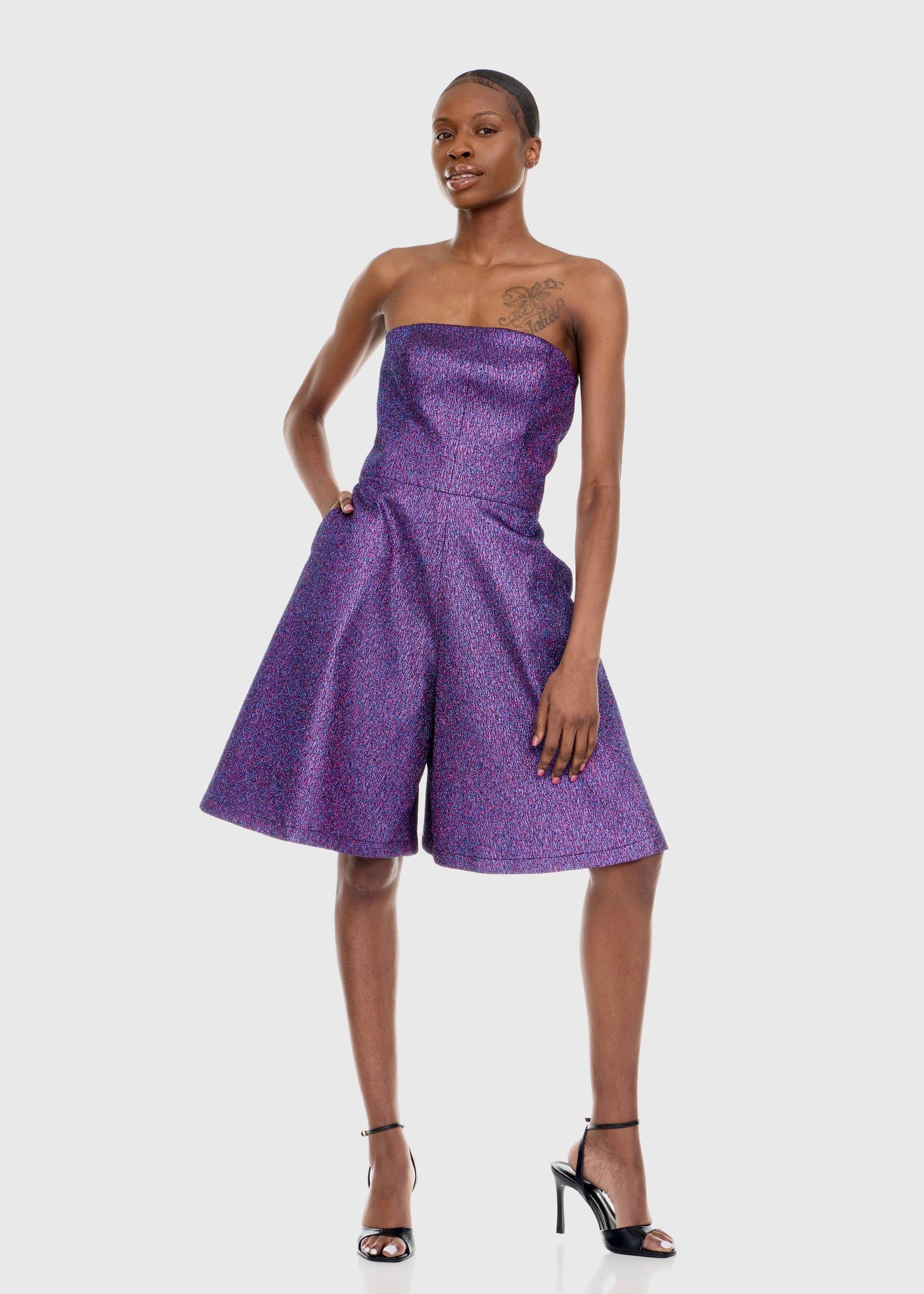 Black woman wearing Strapless Purple Shimmer Romper