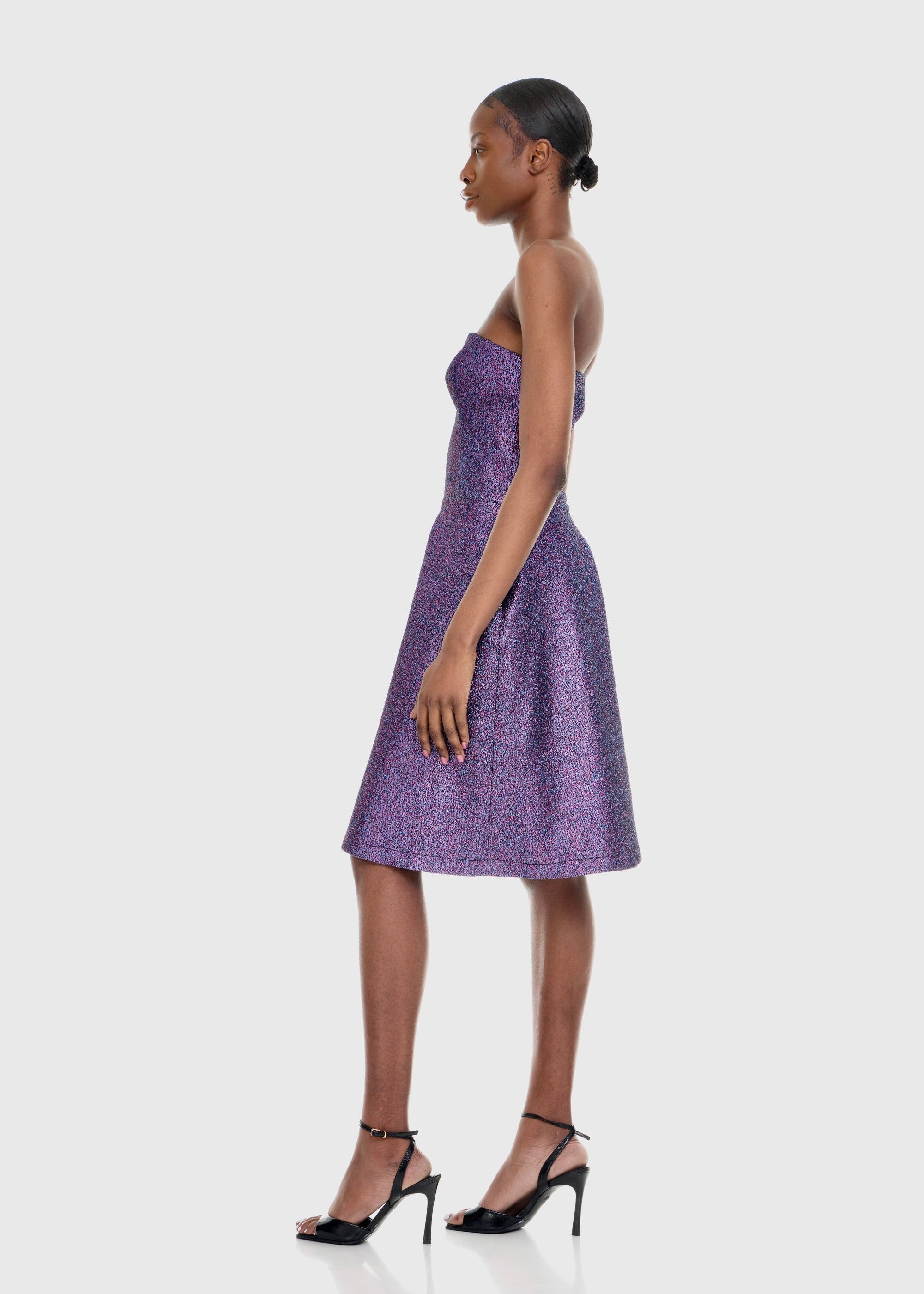 Black woman wearing Strapless Purple Shimmer Romper