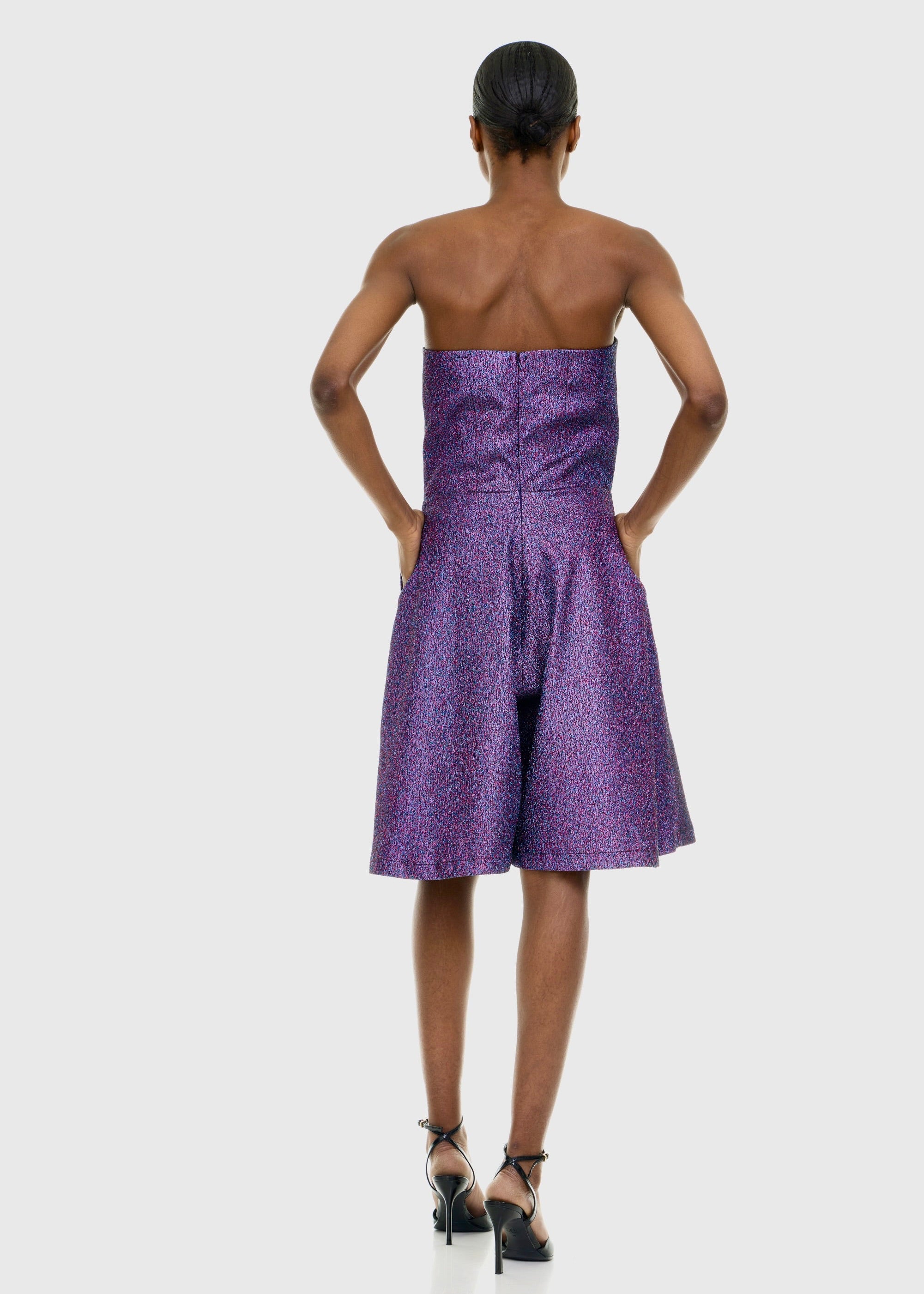 Black woman wearing Strapless Purple Shimmer Romper