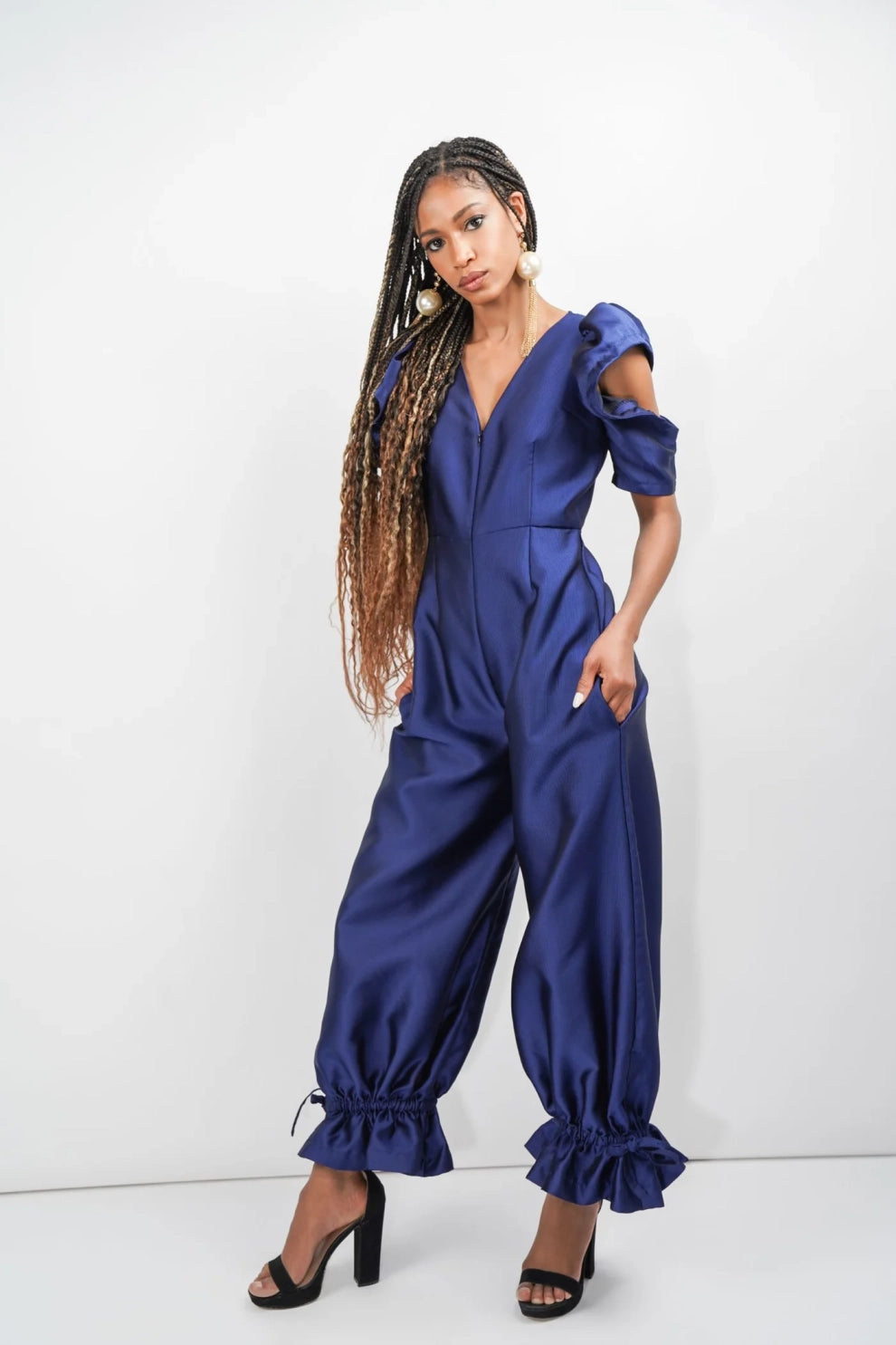 model wearing royal blue jumpsuit