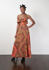 Model wearing the Kariba Maxi Dress with orange and brown tones