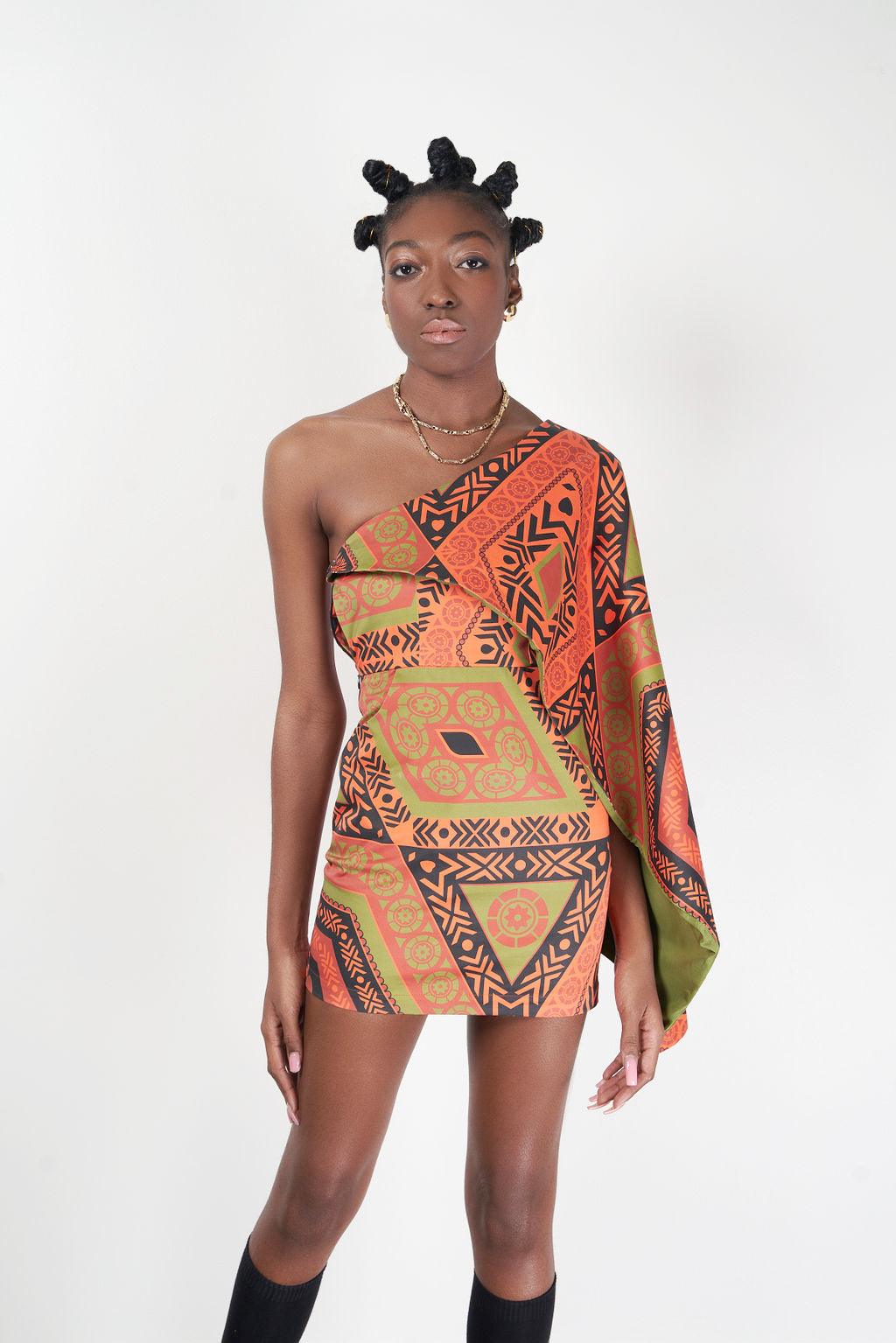 Close-up of the Kivu Dress featuring its unique orange and black design