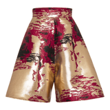 Ola Shorts featuring a gold and black design with intricate patterns