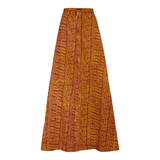 The Praslin Maxi Skirt featuring an orange and yellow pattern