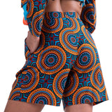 Rear view of a woman wearing the Fiesta Shorts with a colorful design