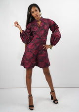 A model showcasing the Kalenjin Romper with red and black patterns