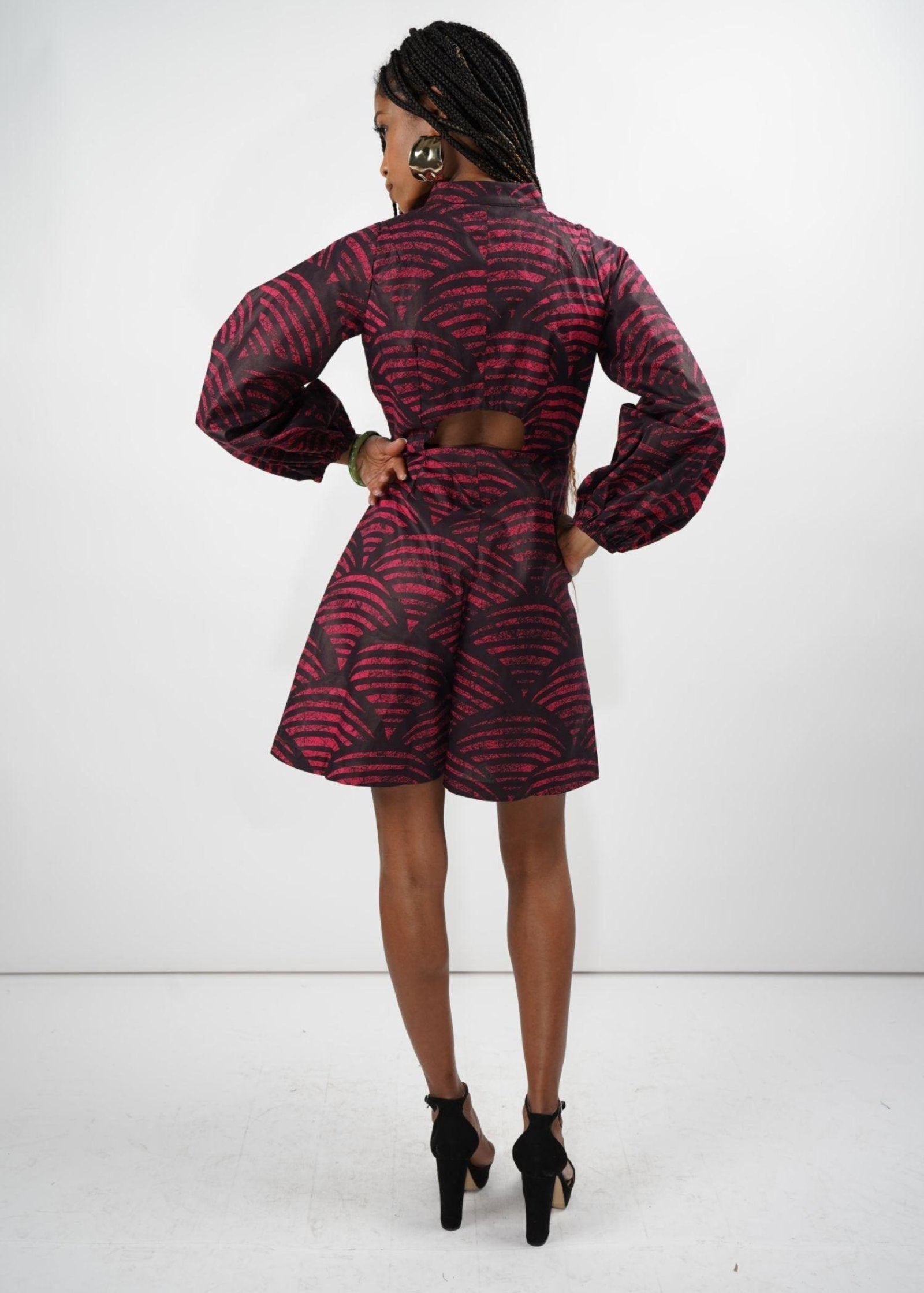 Rear view of the Kalenjin Romper featuring red and black designs