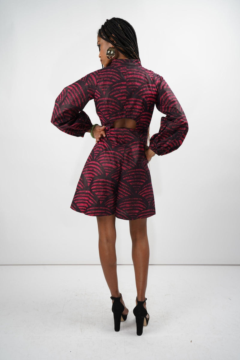 Rear view of the Kalenjin Romper featuring red and black designs