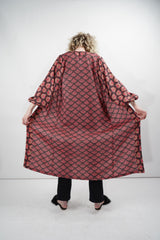 The Nande Duster displayed in red and black with a unique pattern