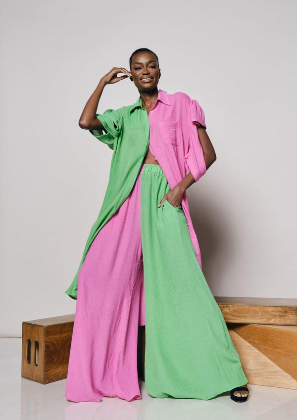 A close-up view of the Zanzibar Shirtdress showcasing its pink and green design